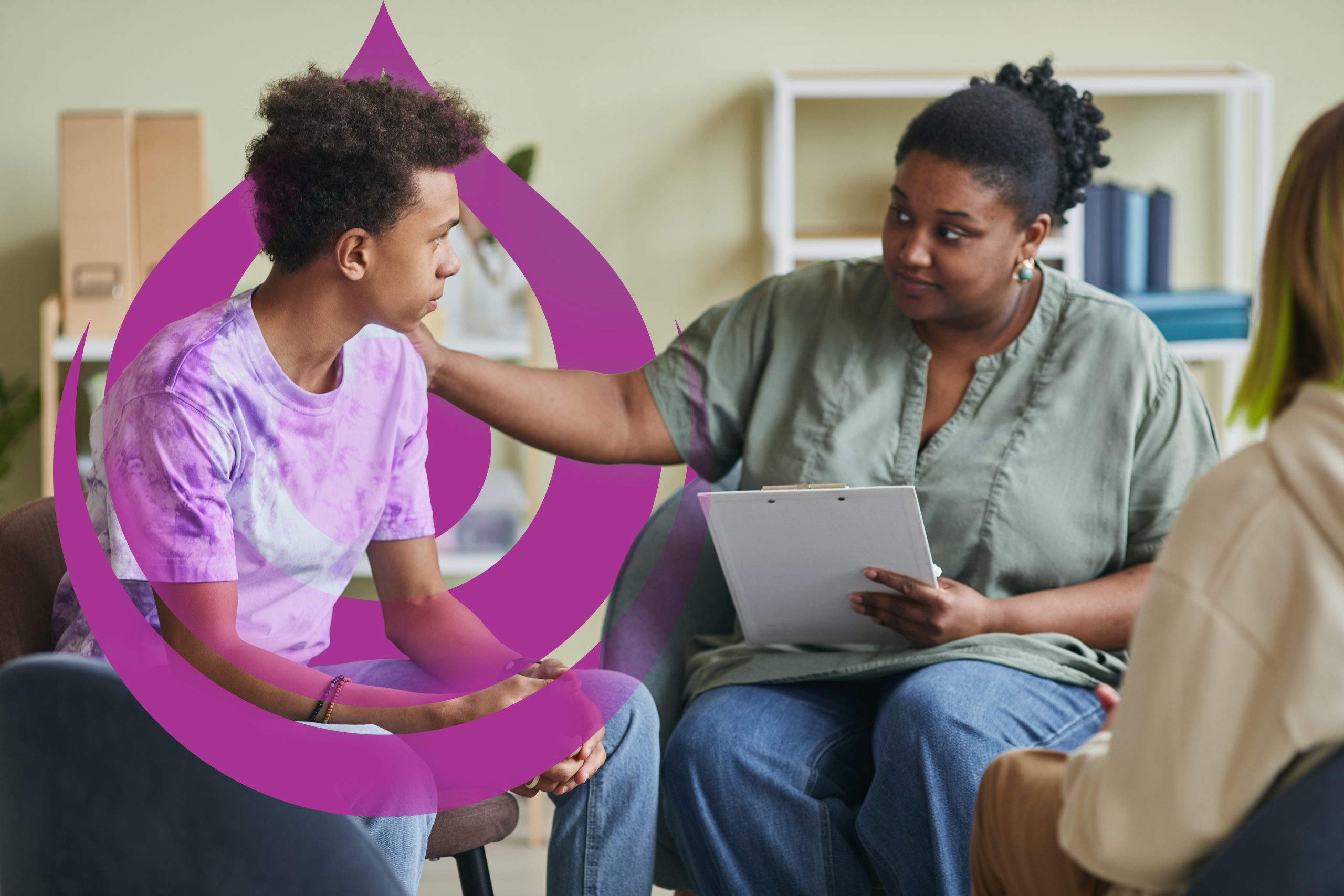 African,Young,Psychologist,Talking,To,Teenage,Boy,During,Therapy,Session