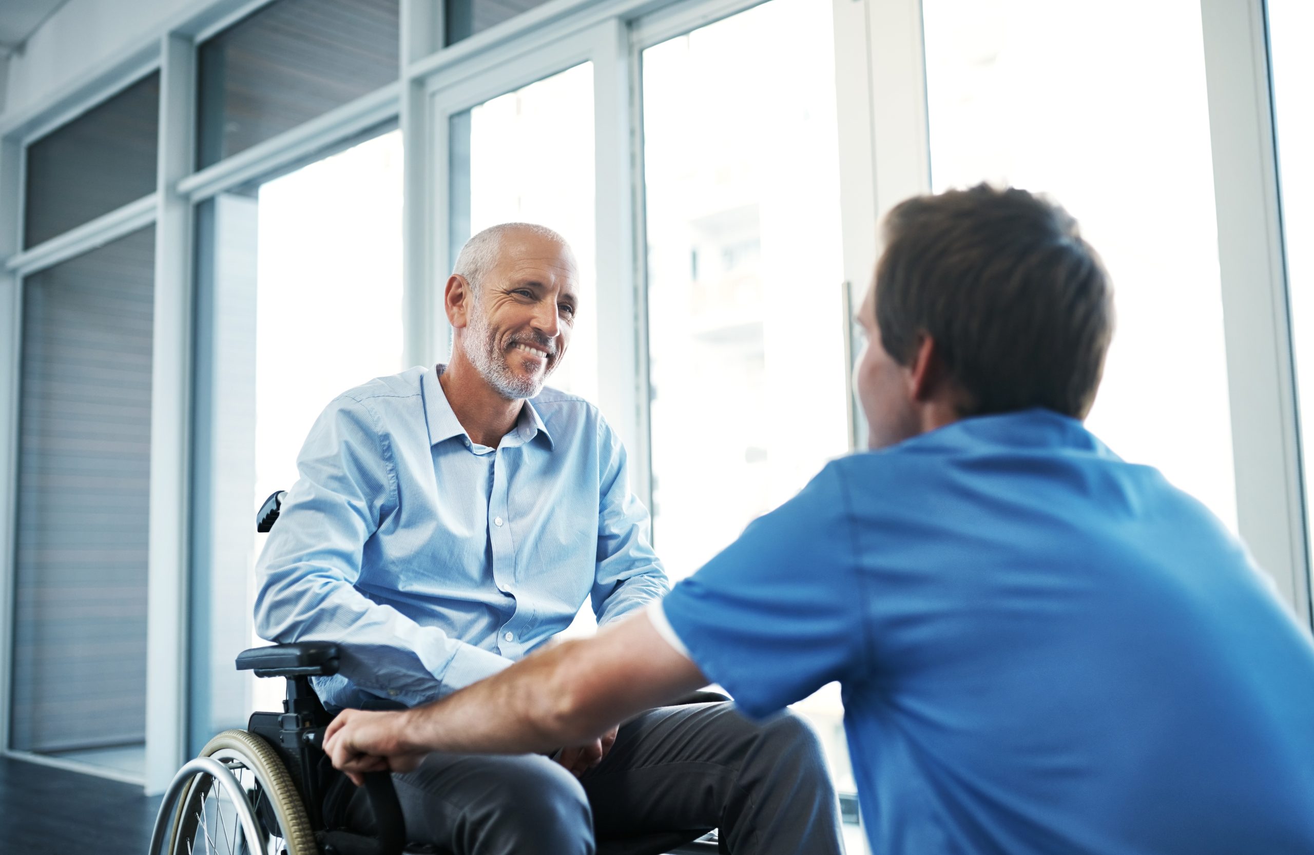 Happy,Man,,Wheelchair,And,Doctor,In,Hospital,For,Senior,Care,
