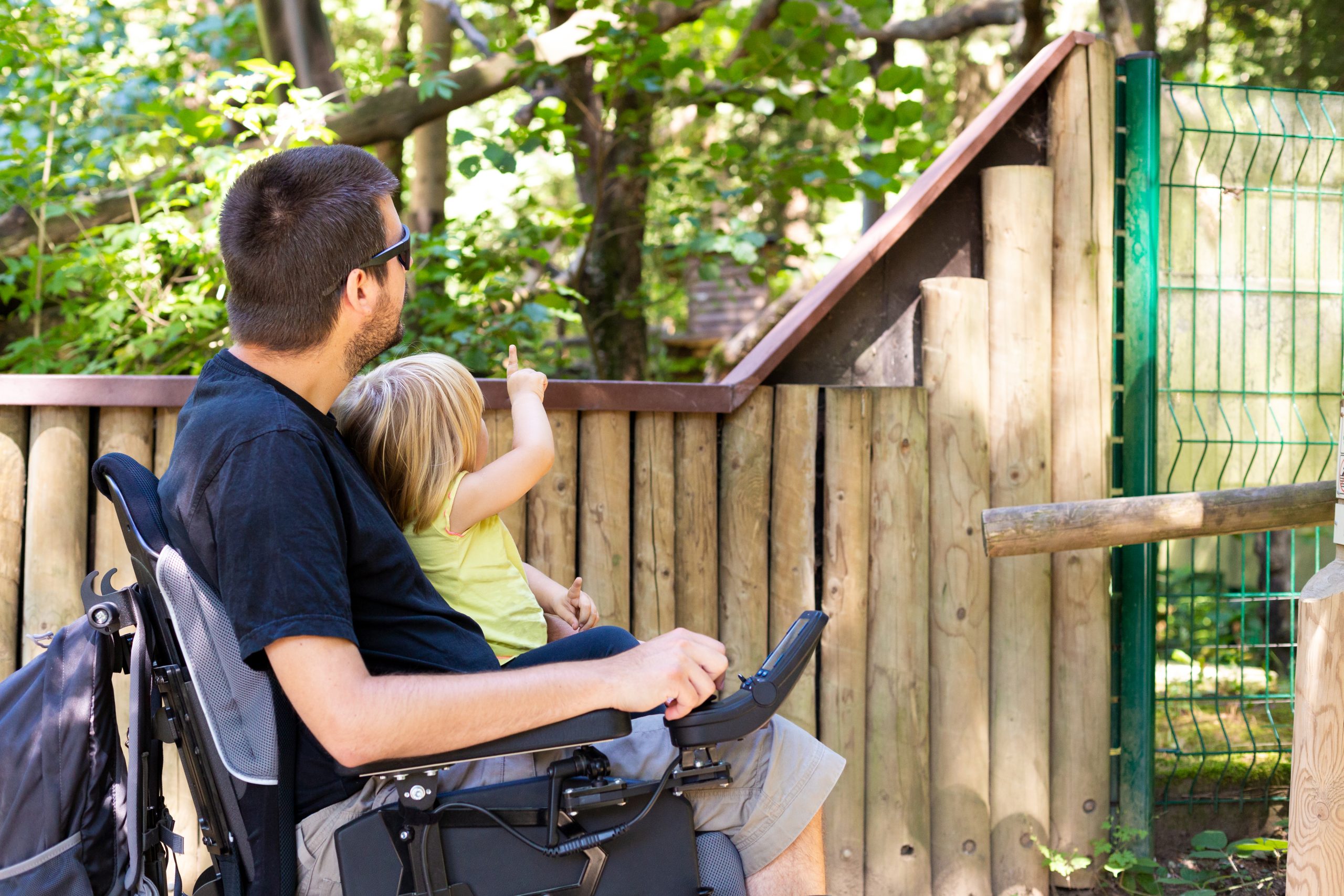 Disabled,Father,In,Wheelchair,Enjoying,Nature,With,Daughter,Girl,In